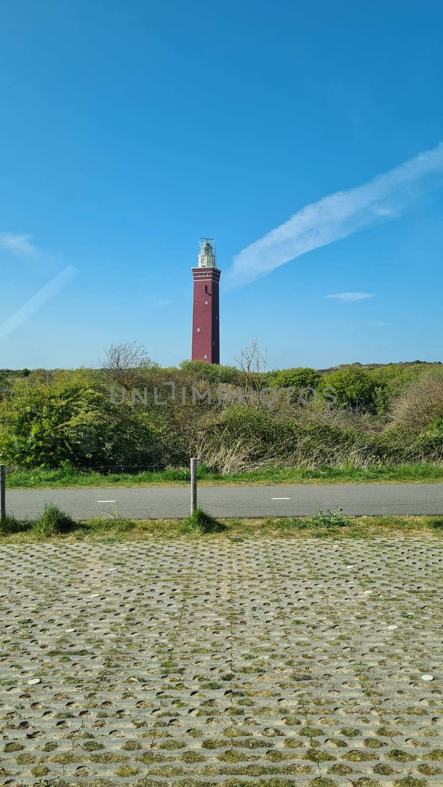 Lighthouse on the western tip of Goeree Island rises above the surrounding dunes, forests and meadows
