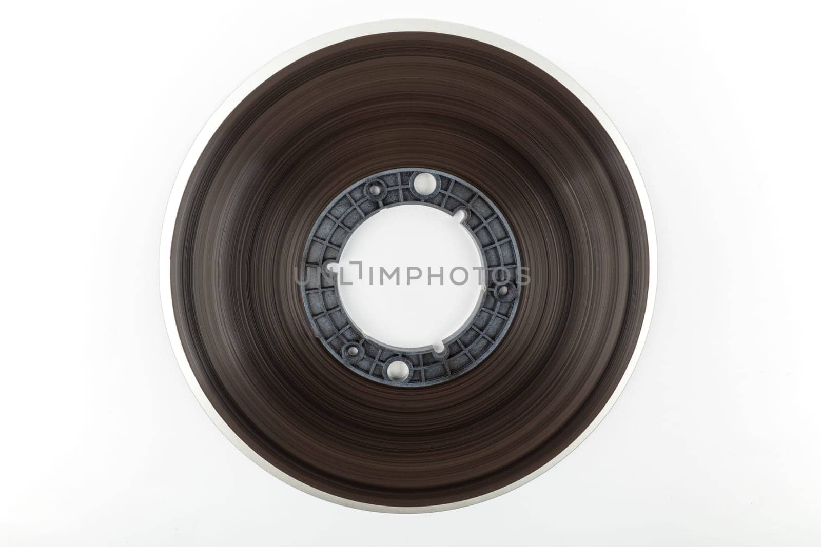Side view of a large tape reel isolated over white background