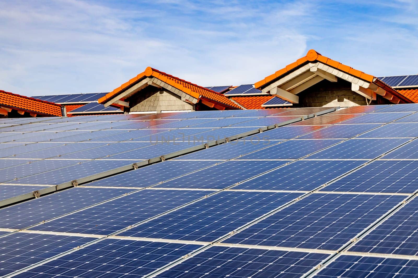 Photovoltaic panels on the roof . Roof Of Solar Panels. View of solar panels (solar cell) in the roof house with sunlight