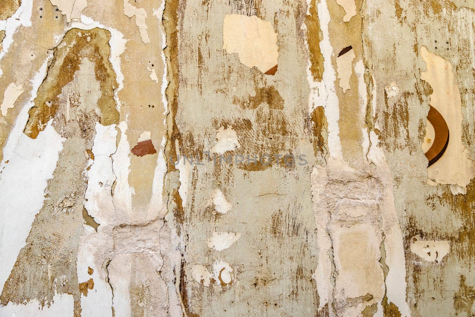 Traces on a scraped house facade ready for renovation