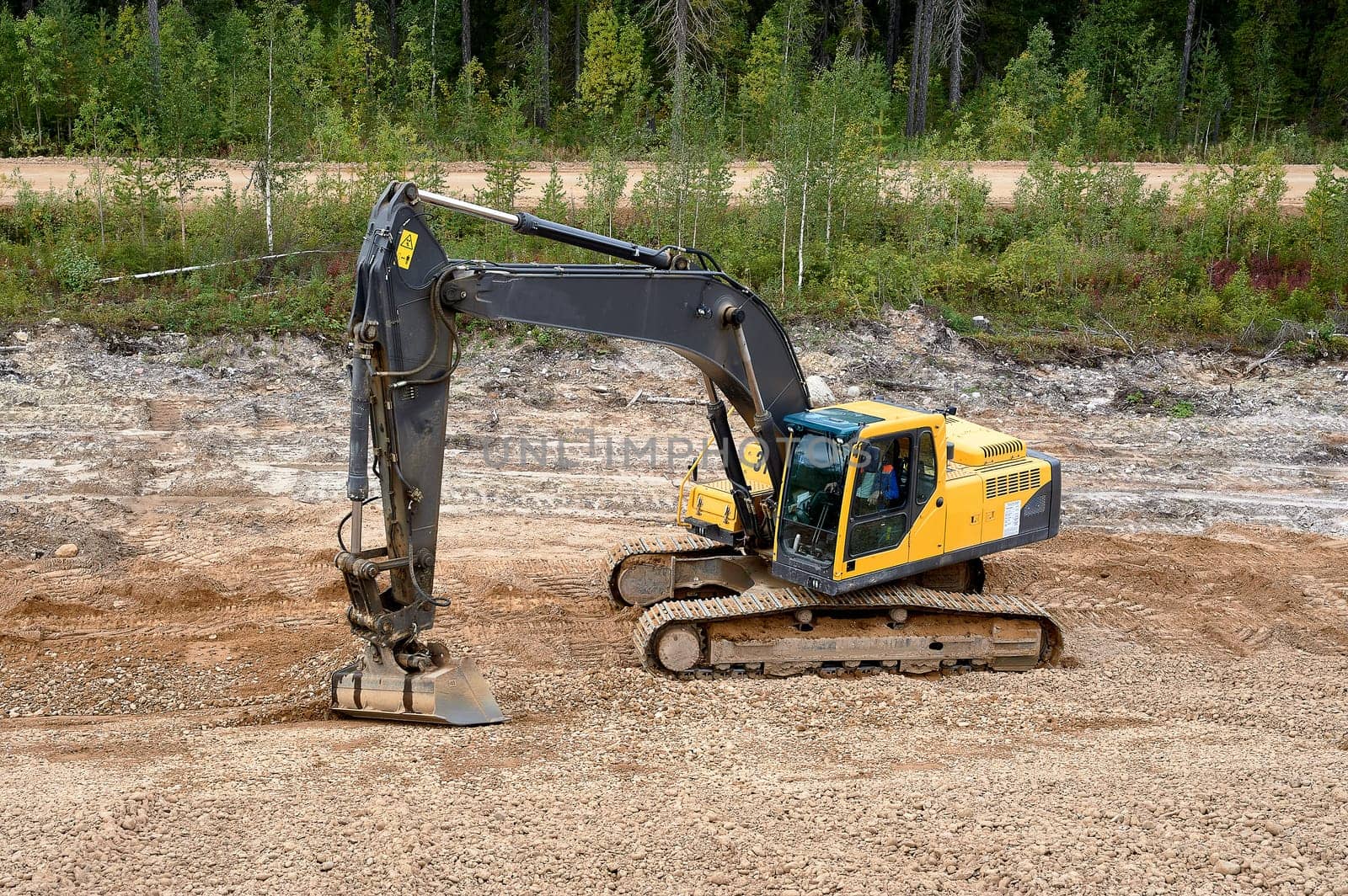 Excavator digs the ground. High quality photo