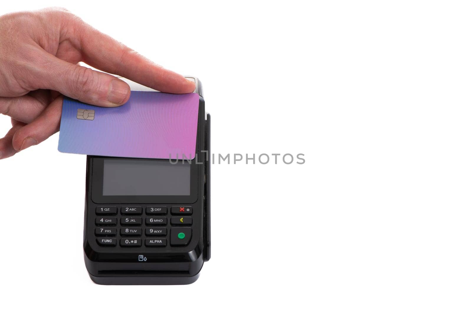 Attached plastic card to the payment terminal with a man's hand on a white isolated background, copy space. High quality photo