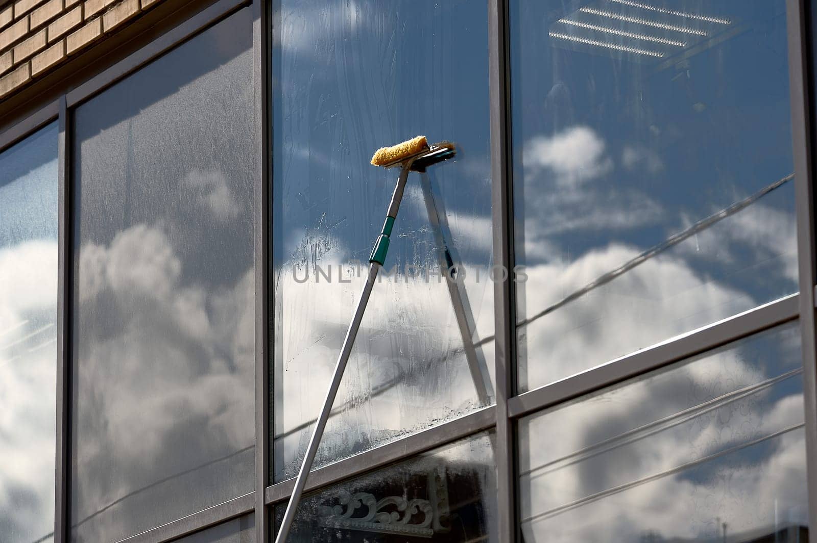 window washing, washing a street shop window. High quality photo