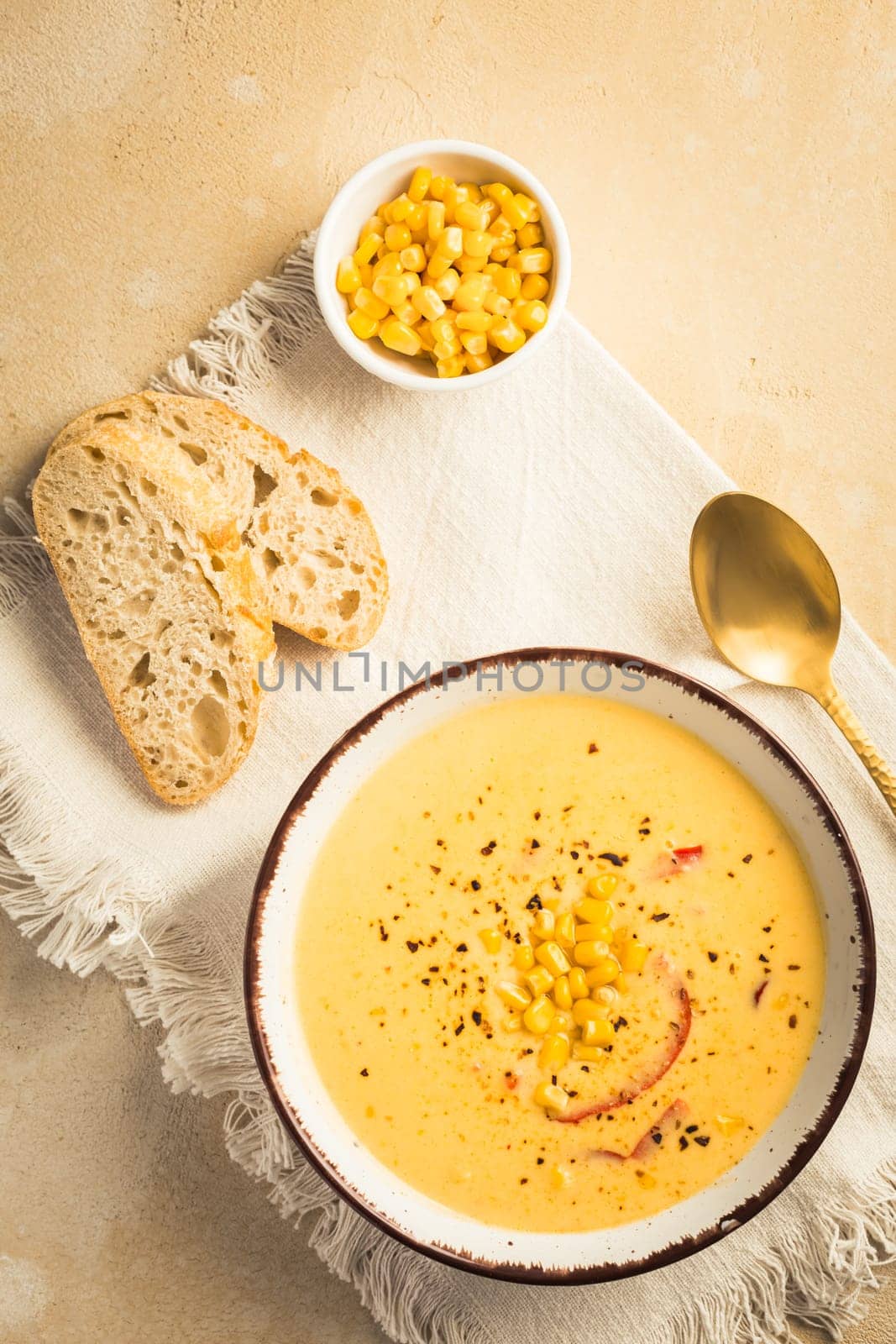 Delicious creamy chilli cheese corn soup served with bread