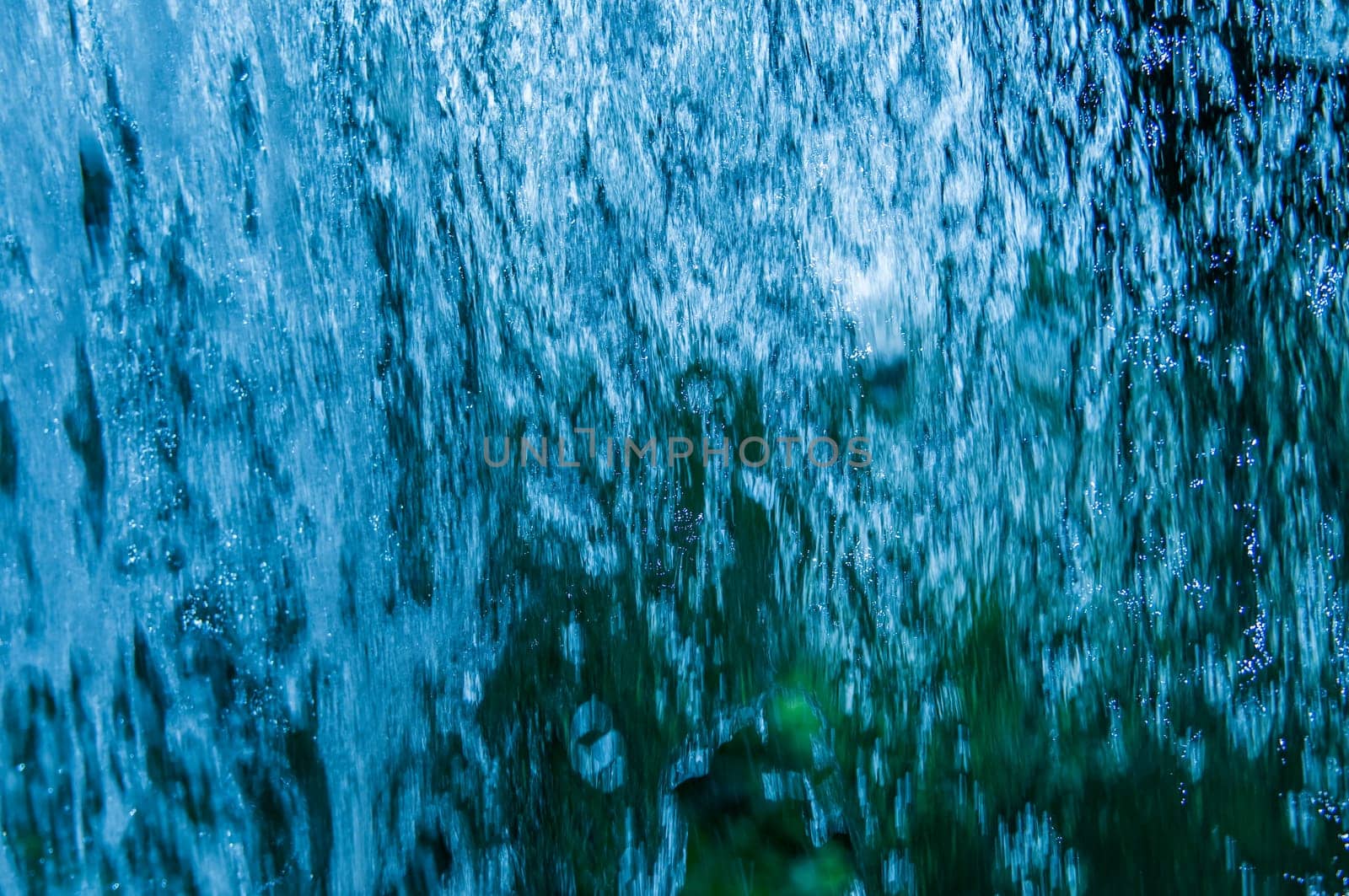Full frame view of cascading water close-up.