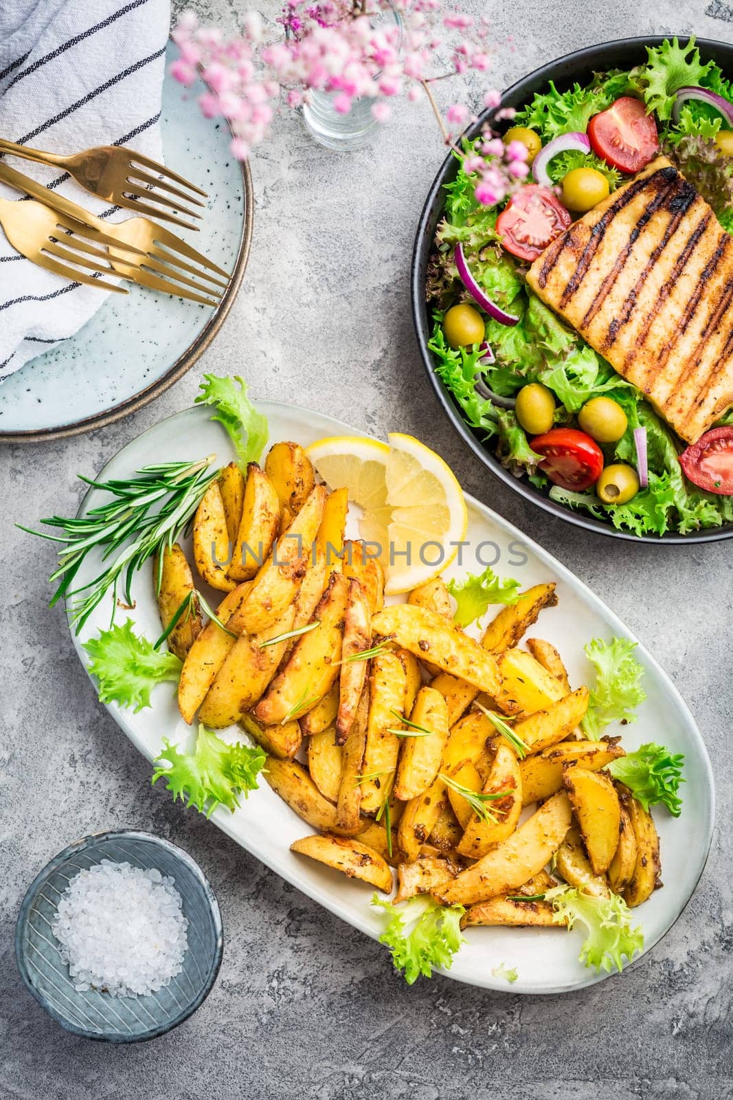 Potato wedges, oven roasted with freshly mixed salad and grilled cheese