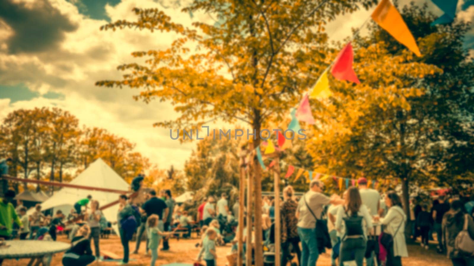 Abstract blur image of people and food trucks in vintage style. Blur image of street festival with bokeh for background usage