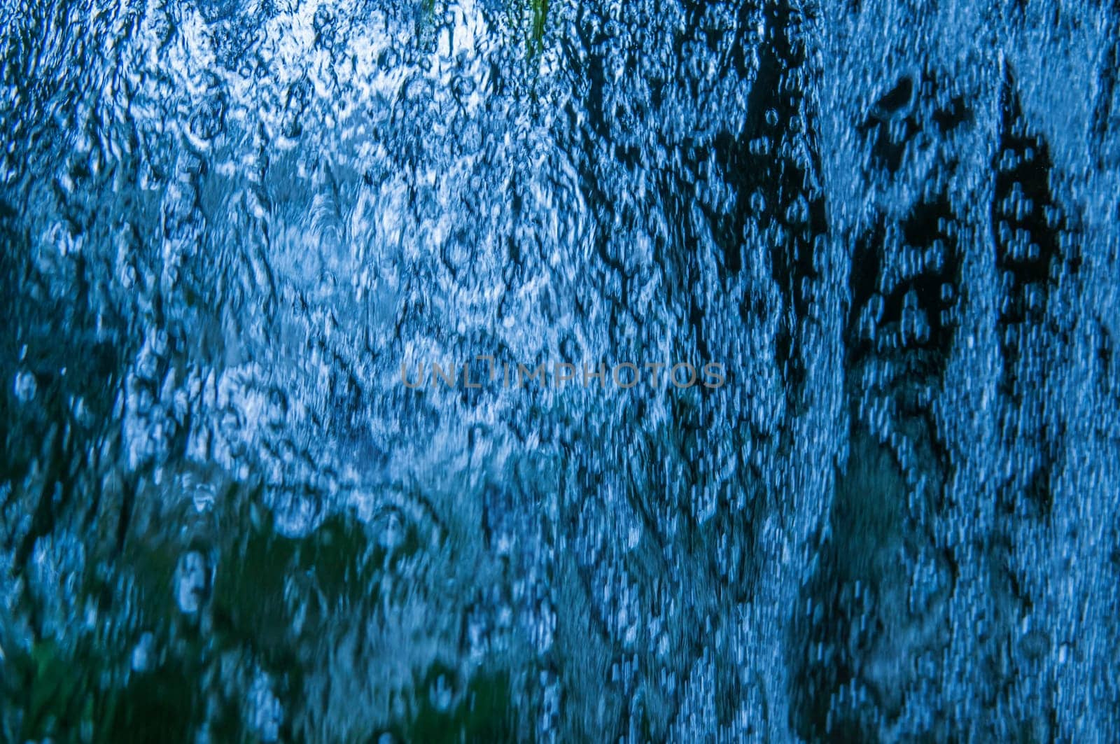 Full frame view of cascading water close-up.