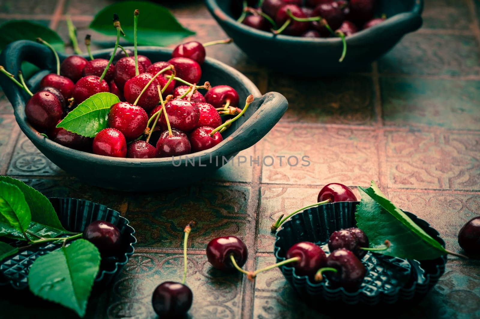 Fresh raw organic sour cherry in bowl on kitchen table