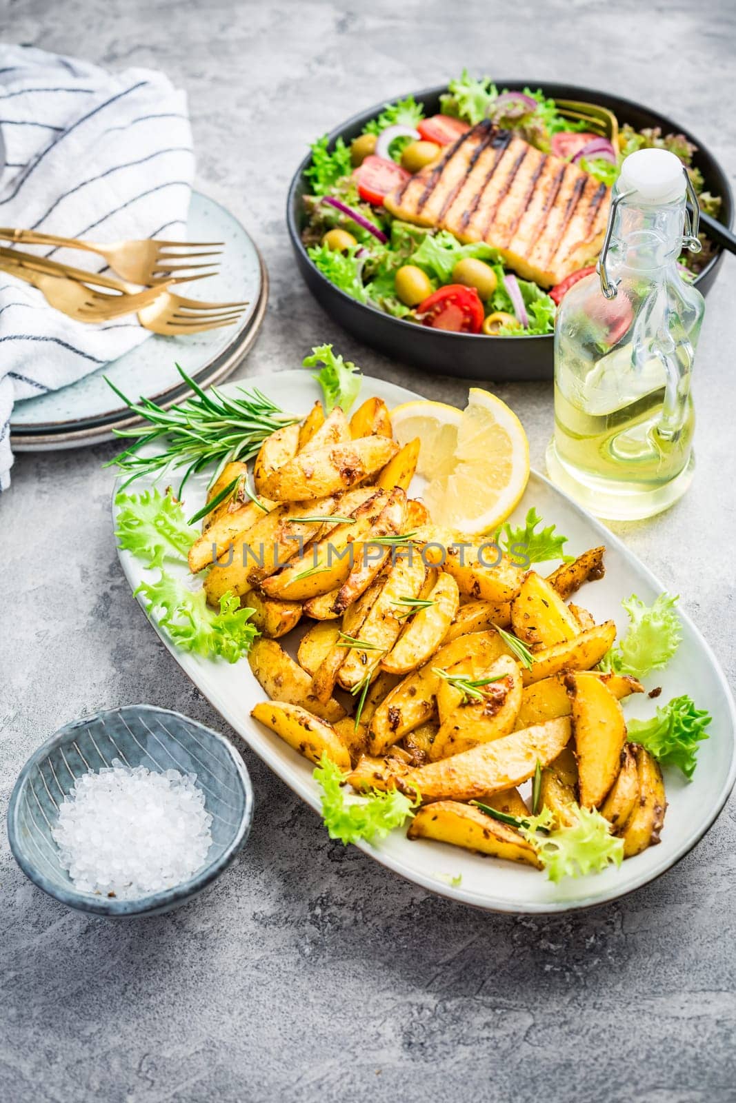 Potato wedges, oven roasted with freshly mixed salad and grilled cheese