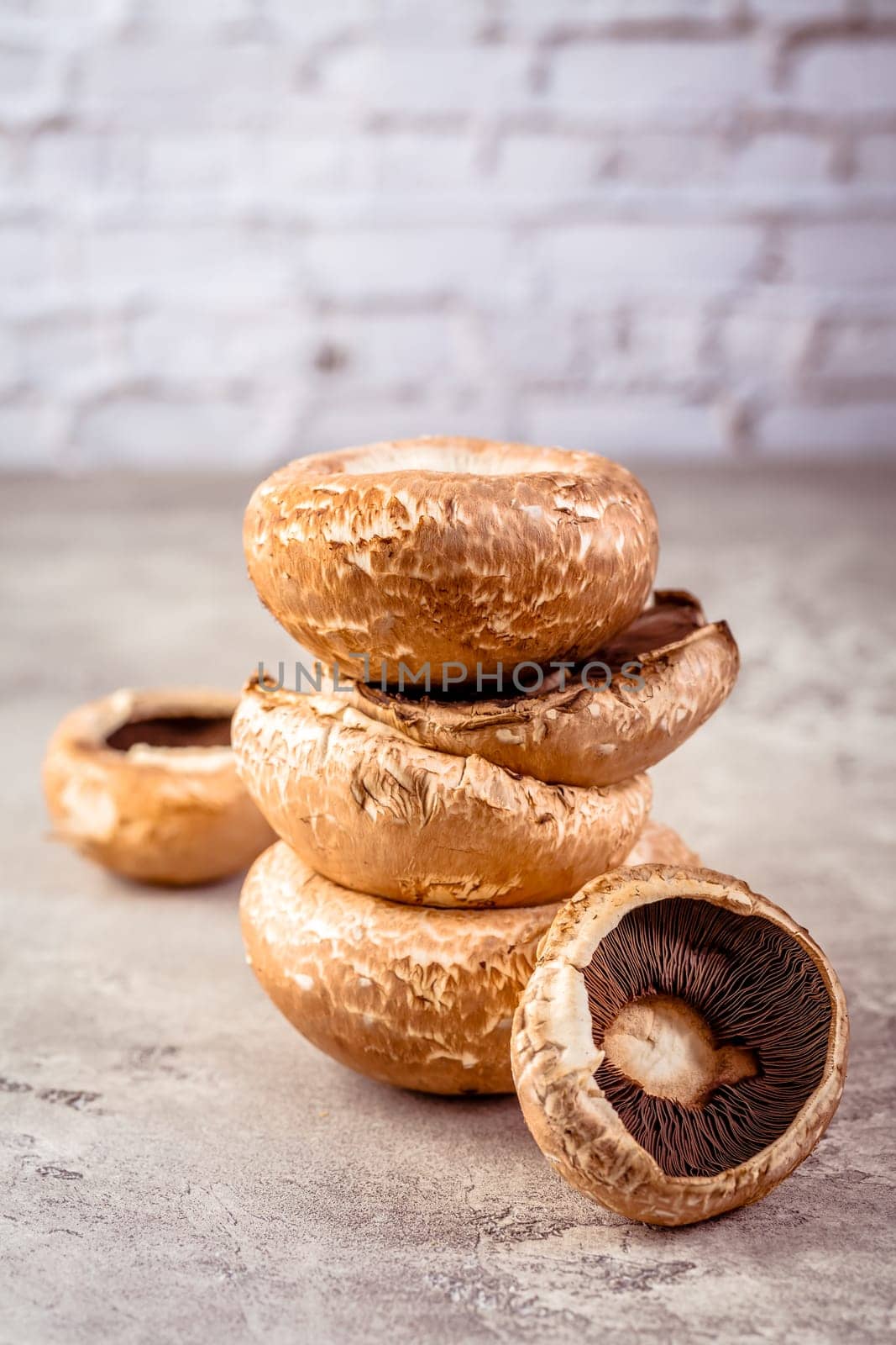 Raw portobello mushrooms on kitchen table prepared for cooking