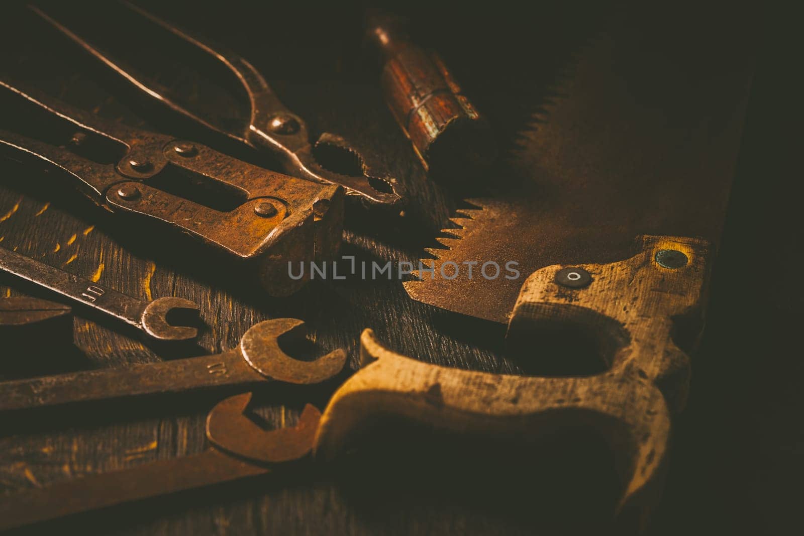 Collection of vintage carpentry tools on old workbench: woodworking, craftsmanship and handwork concept