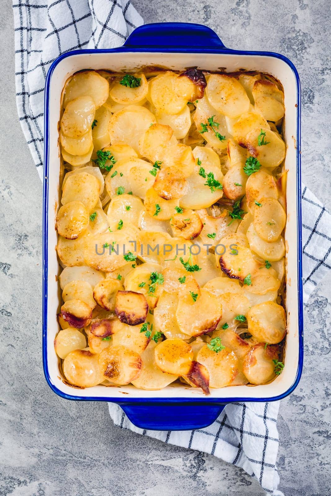 Potato casserole with onions and eggs. Vegetarian meal.