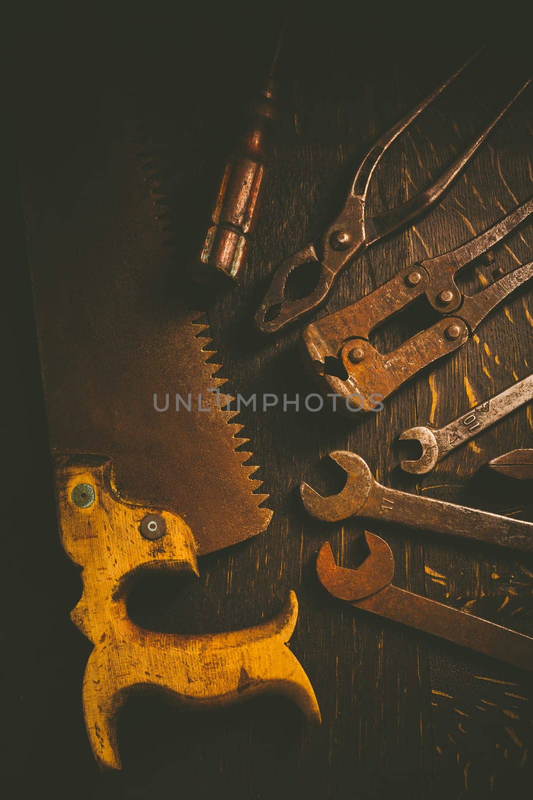 Collection of vintage carpentry tools on old workbench: woodworking, craftsmanship and handwork concept