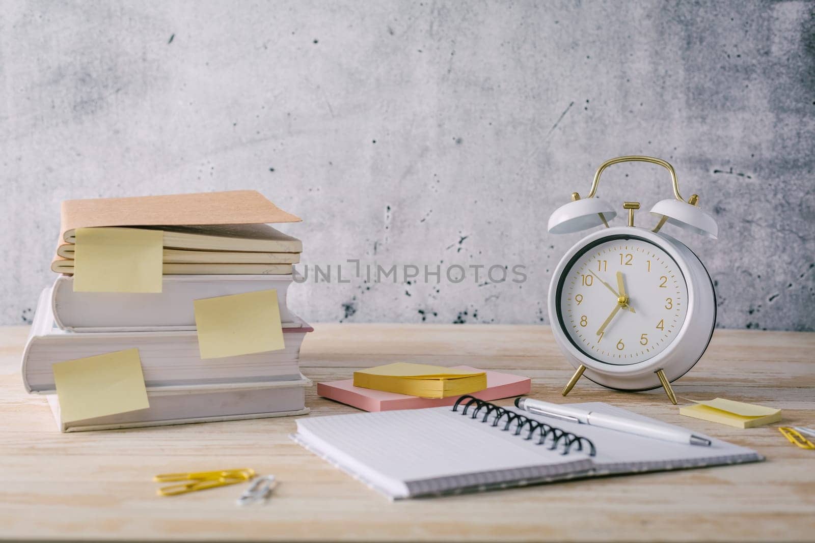 Concept of time management for office and school. Books, notepads with stickers