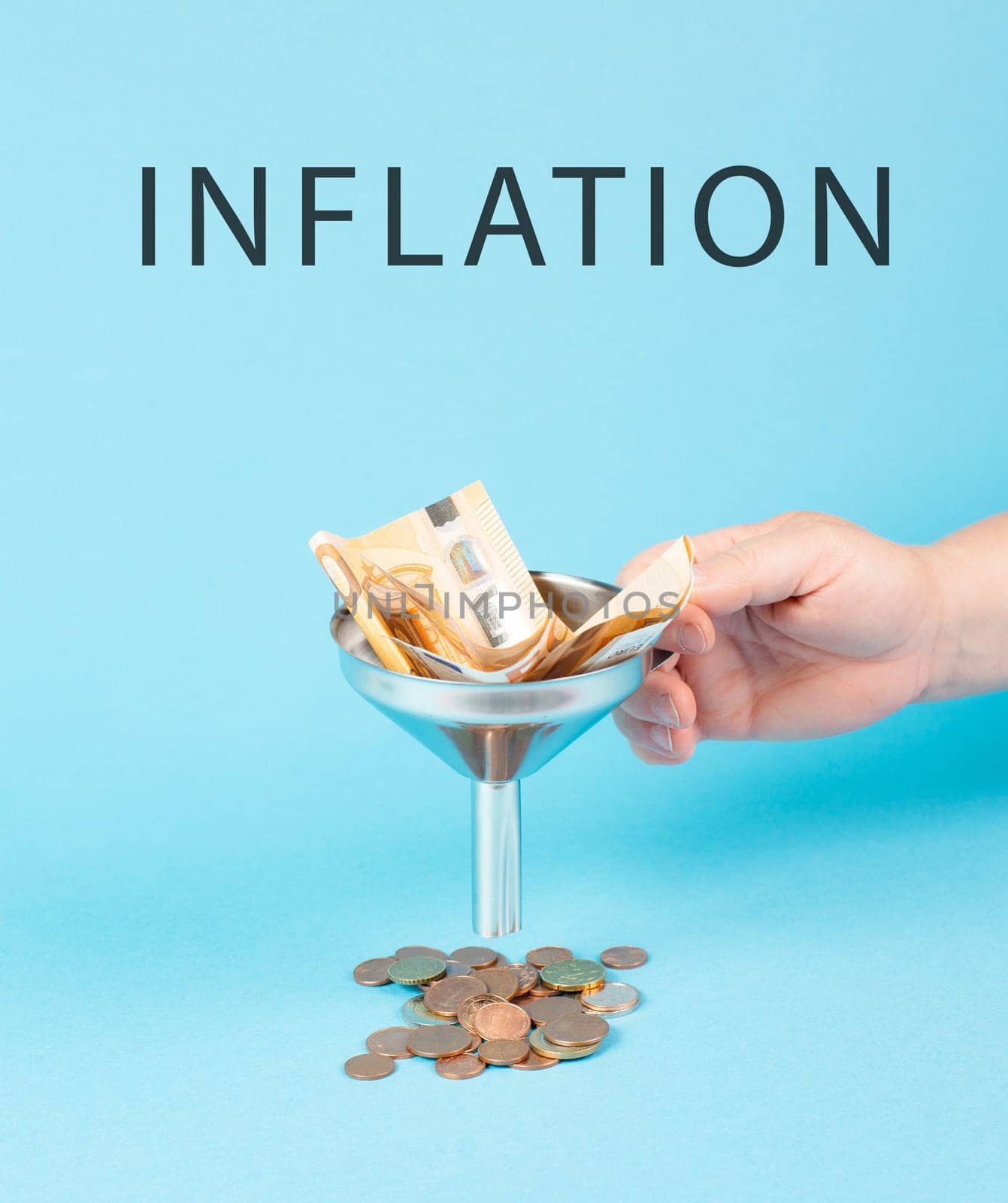 Inflation and financial crash, euro banknotes in a funnel become coins, economic development and increasing prices, worthless money