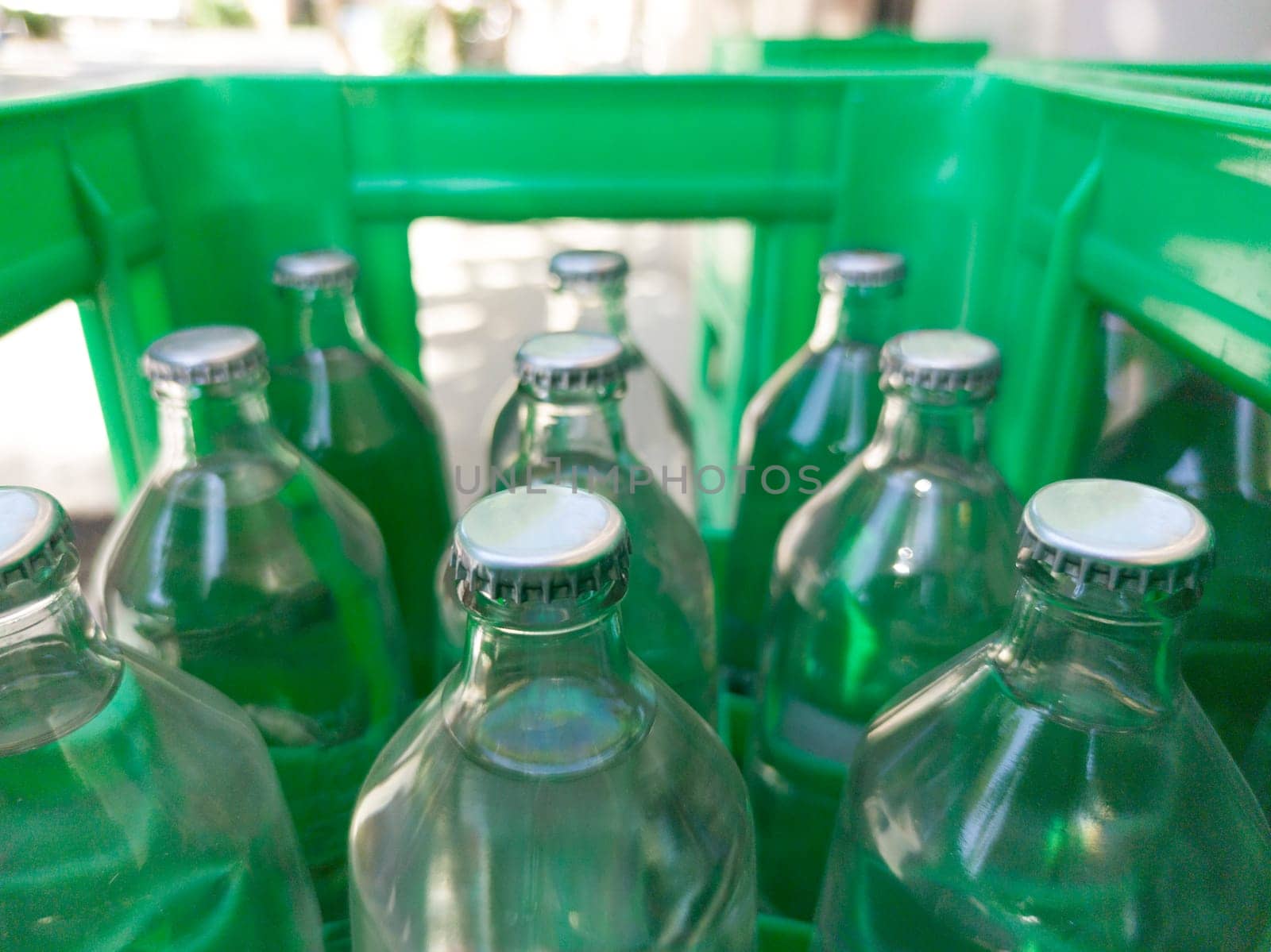 Glass bottled water on his box. Selective focus