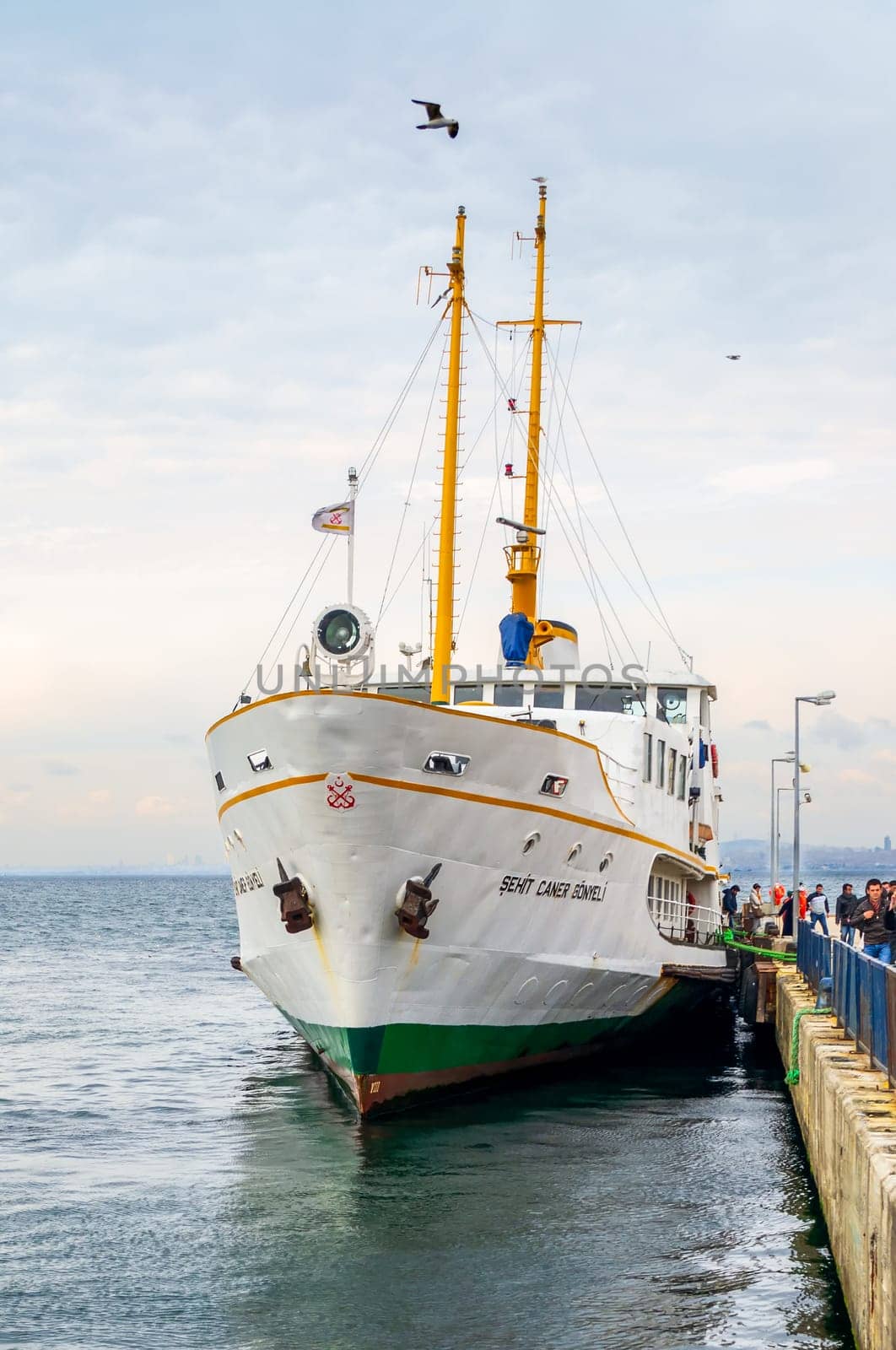 Istanbul, Turkey - March 3 2013: Passengers unloading from local ferry terminal of Buyukada - Princess Island - with calm sea and clear sky