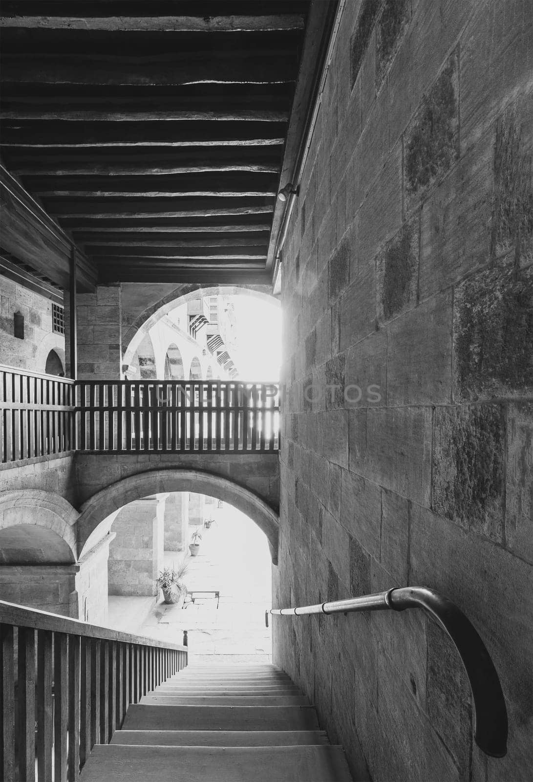 Staircase going down with wooden balustrade at caravansary - Wikala - of Bazaraa, suited in Gamalia district, Medieval Cairo, Egypt