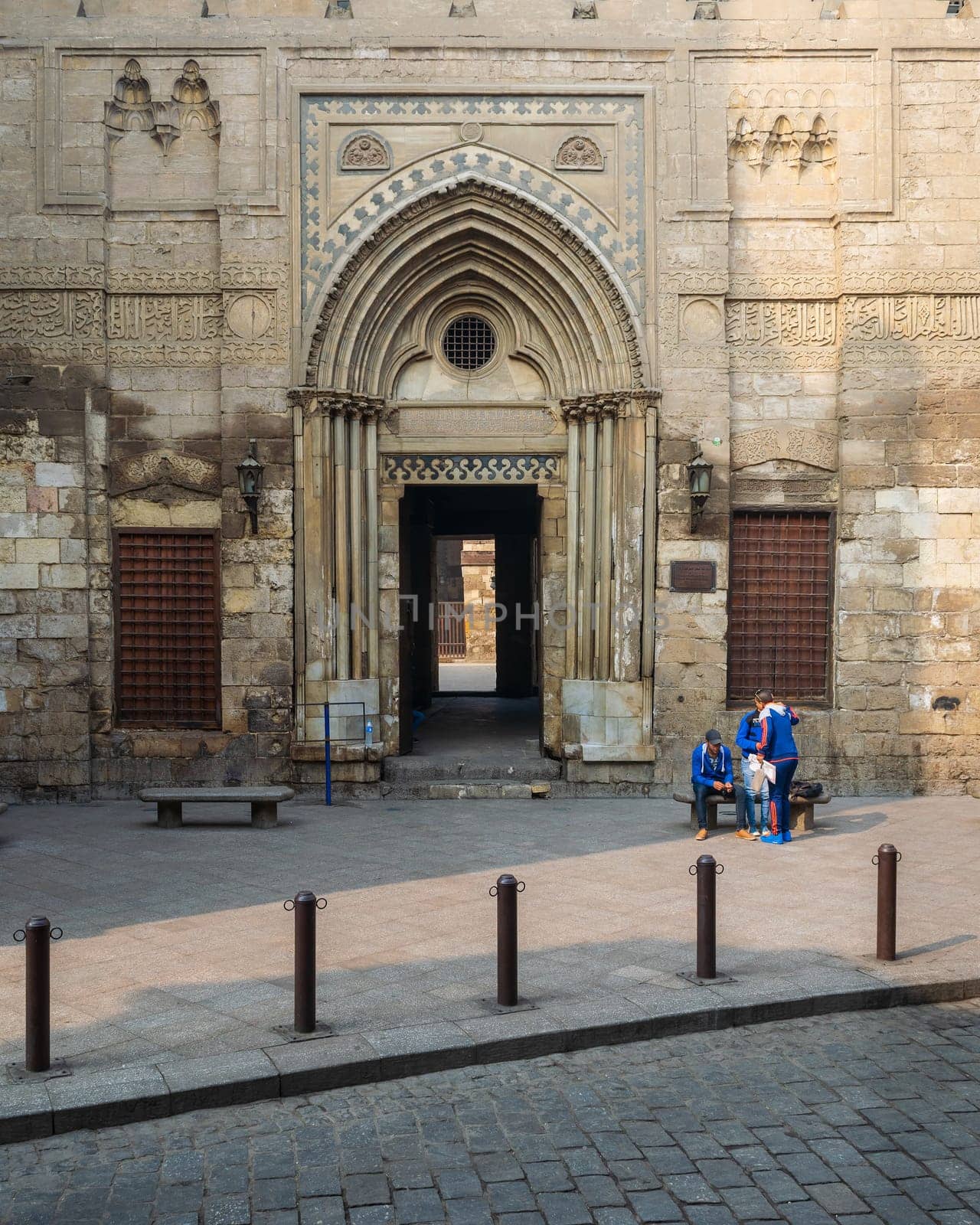 Cairo, Egypt- December 12 2015: Entrance of theological school and Mausoleum of Sultan Qalawun, Moez Street
