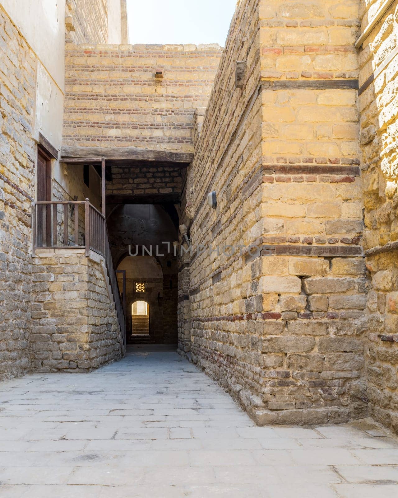 Exterior daylight shot of old abandoned stone bricks passage surrounding Sultan Qalawun Complex located in Al Moez Street, Cairo, Egypt