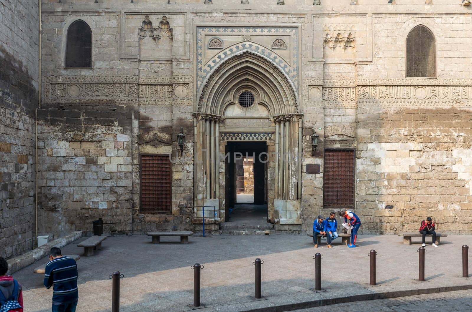 Cairo, Egypt- December 12 2015: Entrance of theological school and Mausoleum of Sultan Qalawun, Moez Street