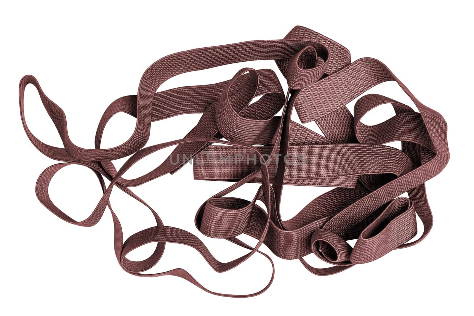 Elastic band isolated. Close-up of a pile of red brown band for sewing clothes isolated on a white background. Used in the manufacture and repair of clothing. Macro.
