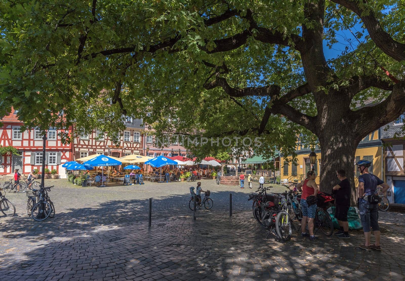 Restaurants with guests on the historic Schlossplatz in Frankfurt-Hoechst, germany