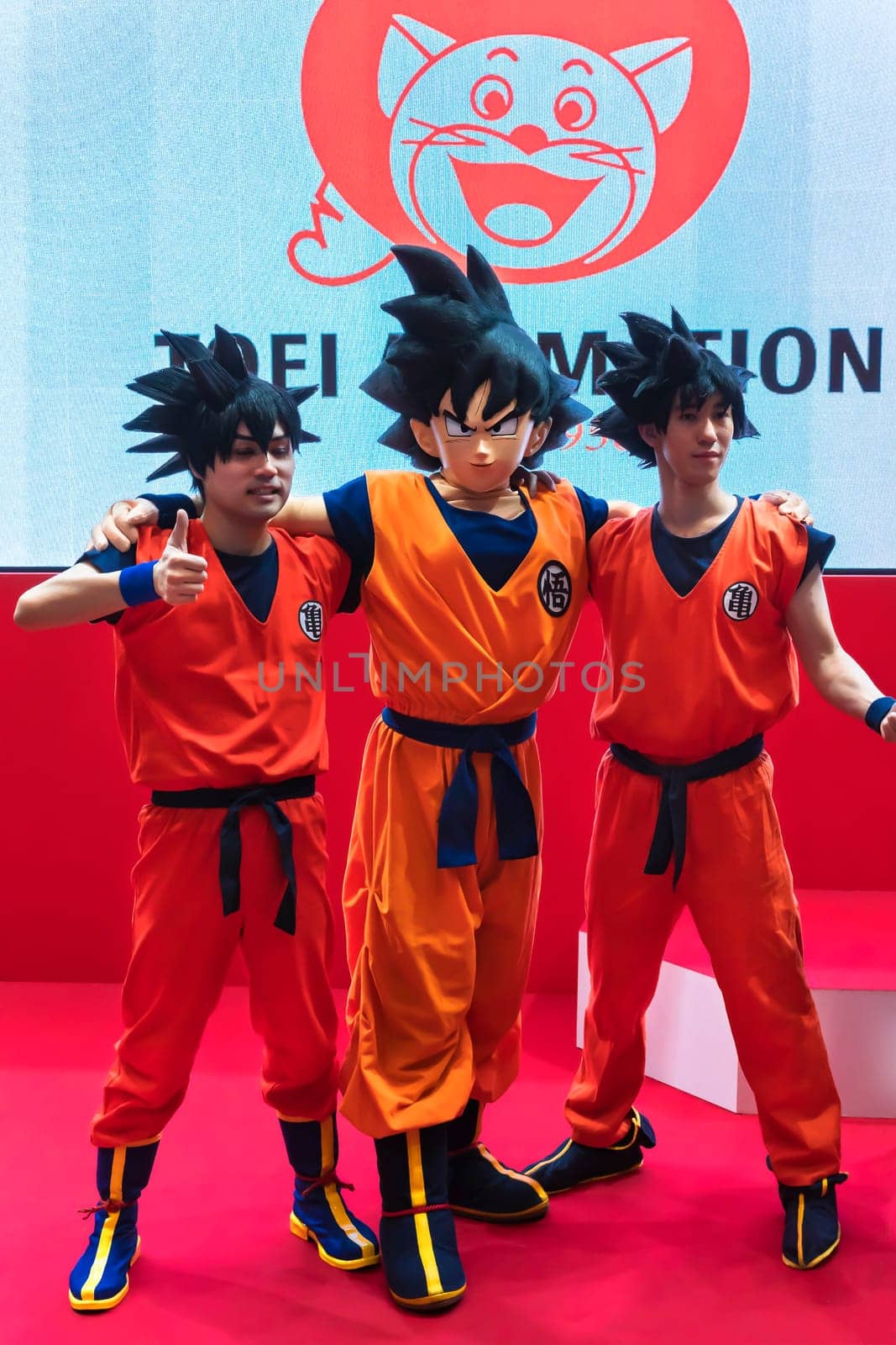 chiba, japan - december 22 2018: Three young men cosplayers wearing costume and wig of the character Son Goku of the manga and anime series of Dragon Ball during the convention Jump Festa 19.