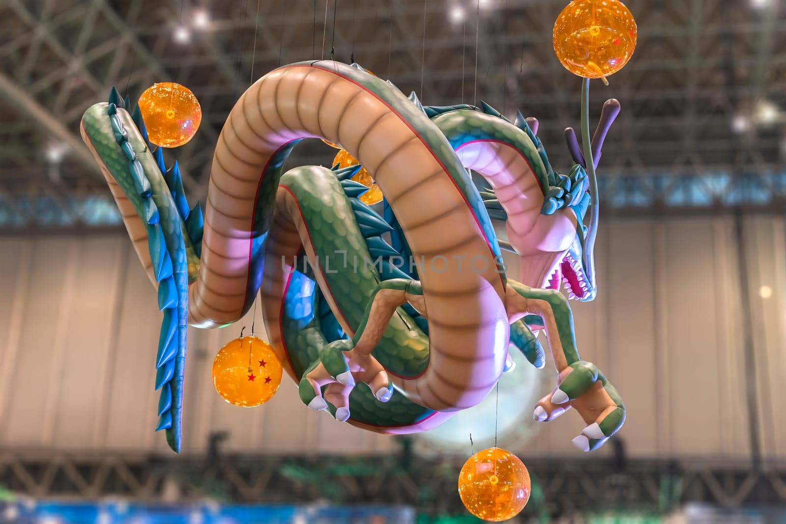 chiba, japan - december 22 2018: Huge inflatable structure depicting the dragon Shenron from the anime and manga serie of Dragon Ball floating under the ceiling of the anime convention Jump Festa 19.