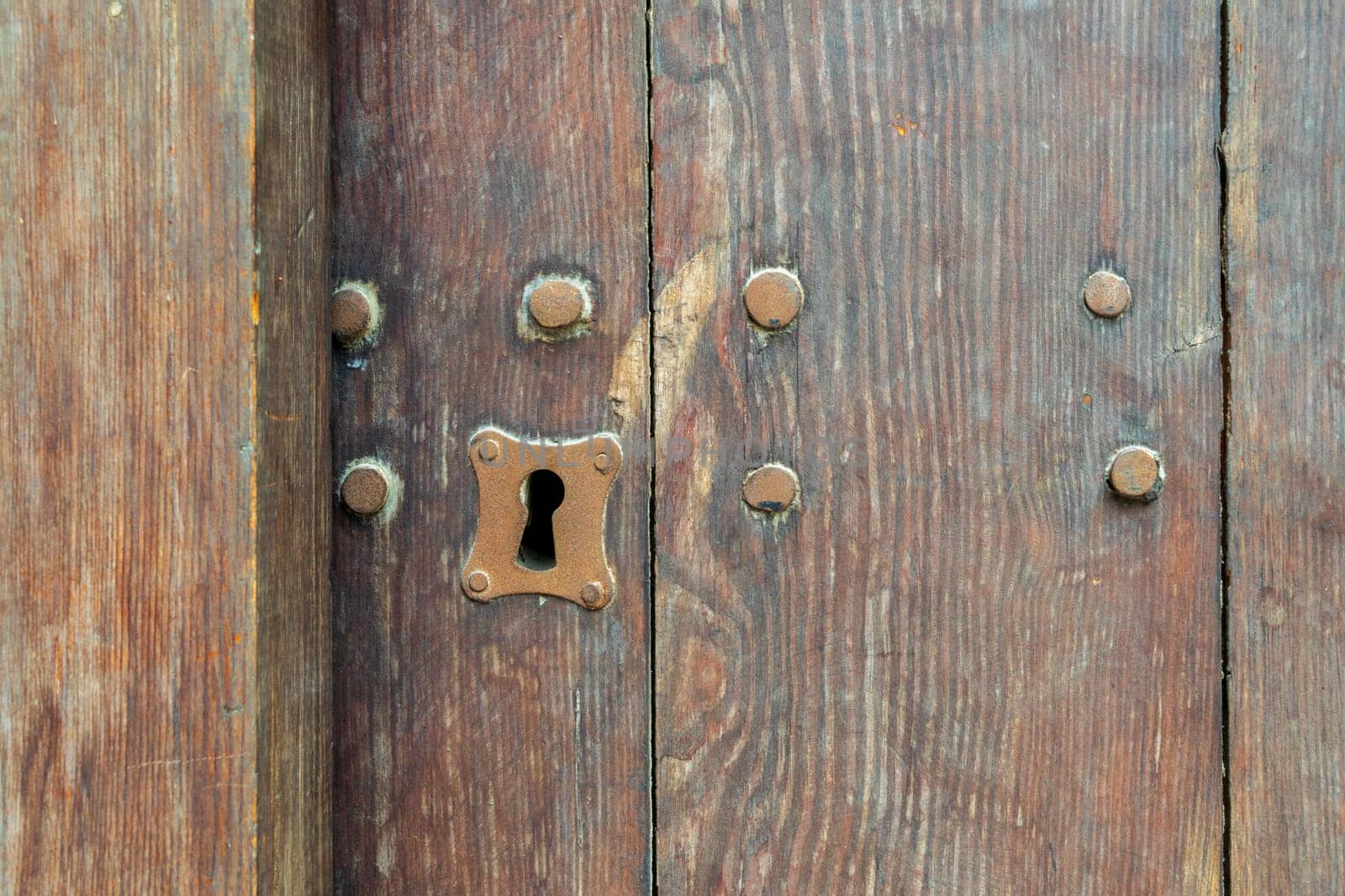 Vintage keyhole in old wooden grunge door