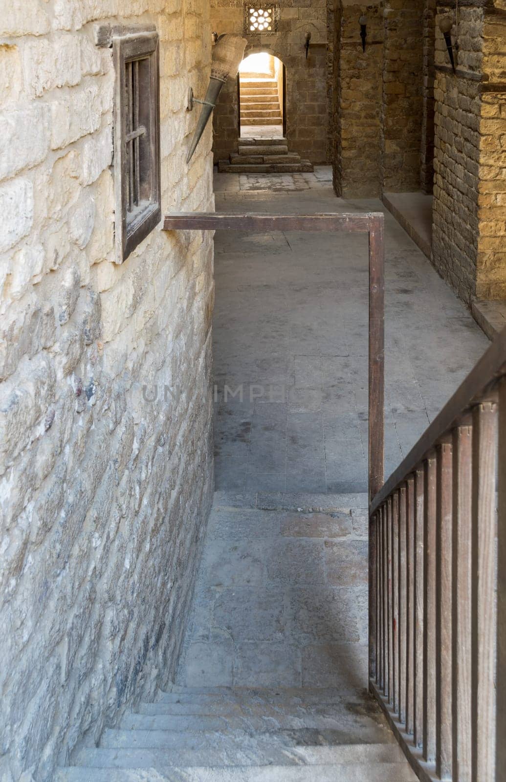Exterior daylight shot of old abandoned stone bricks passage surrounding Sultan Qalawun Complex located in Al Moez Street, Cairo, Egypt
