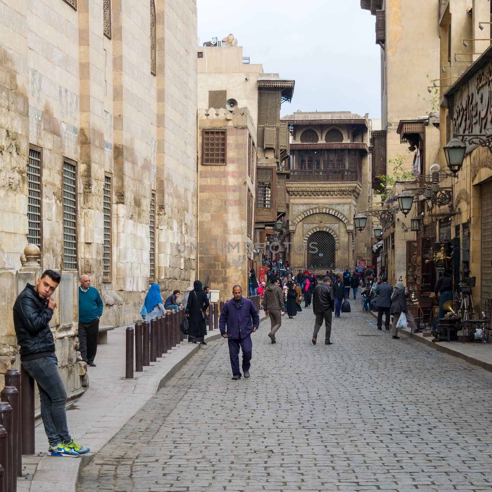 Cairo, Egypt- January 2 2016: Moez Street with local visitors and Sabil-Kuttab of Katkhuda historic building at the far end, Gamalia district, Old Cairo