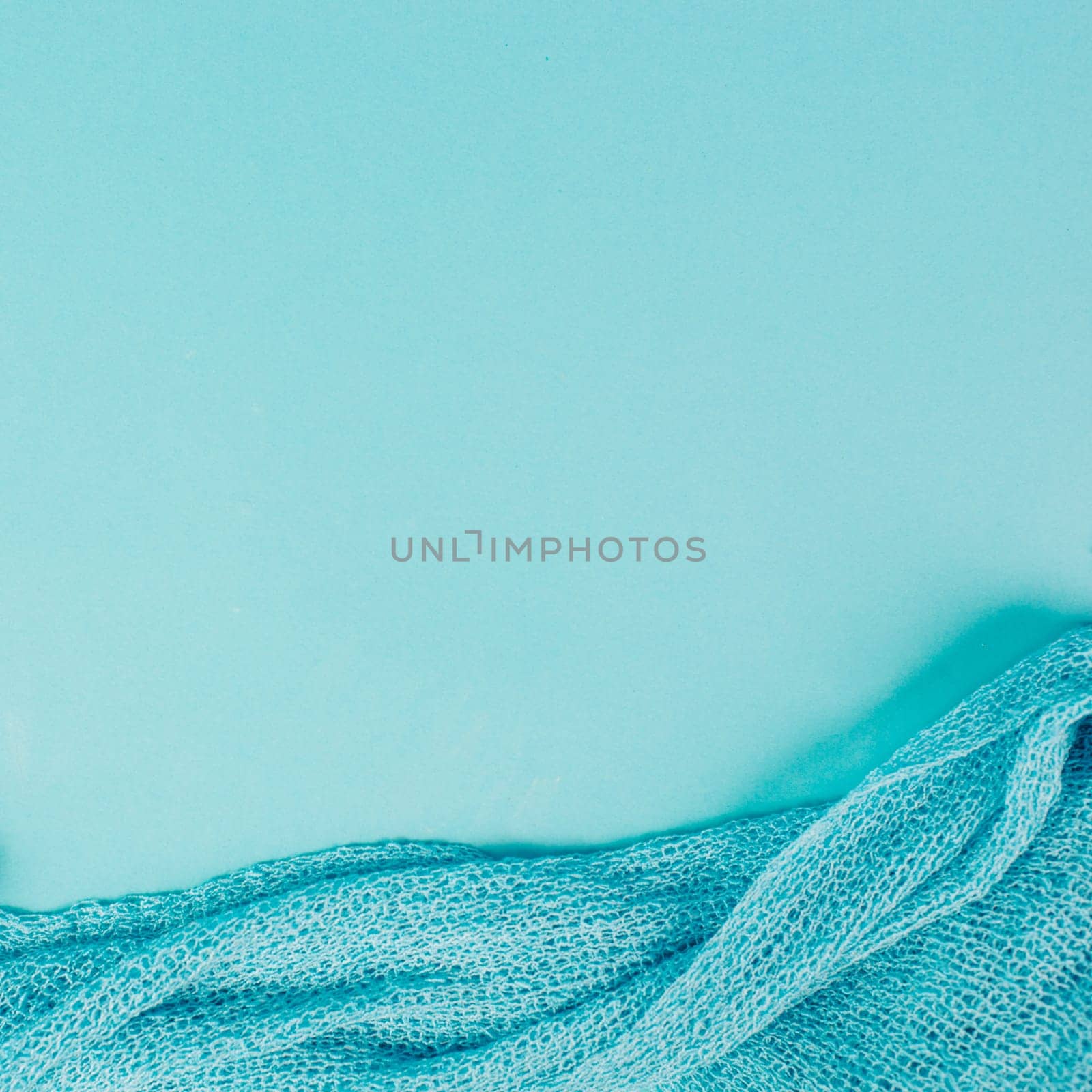 Blue colored background with a woven cloth, copy space for text