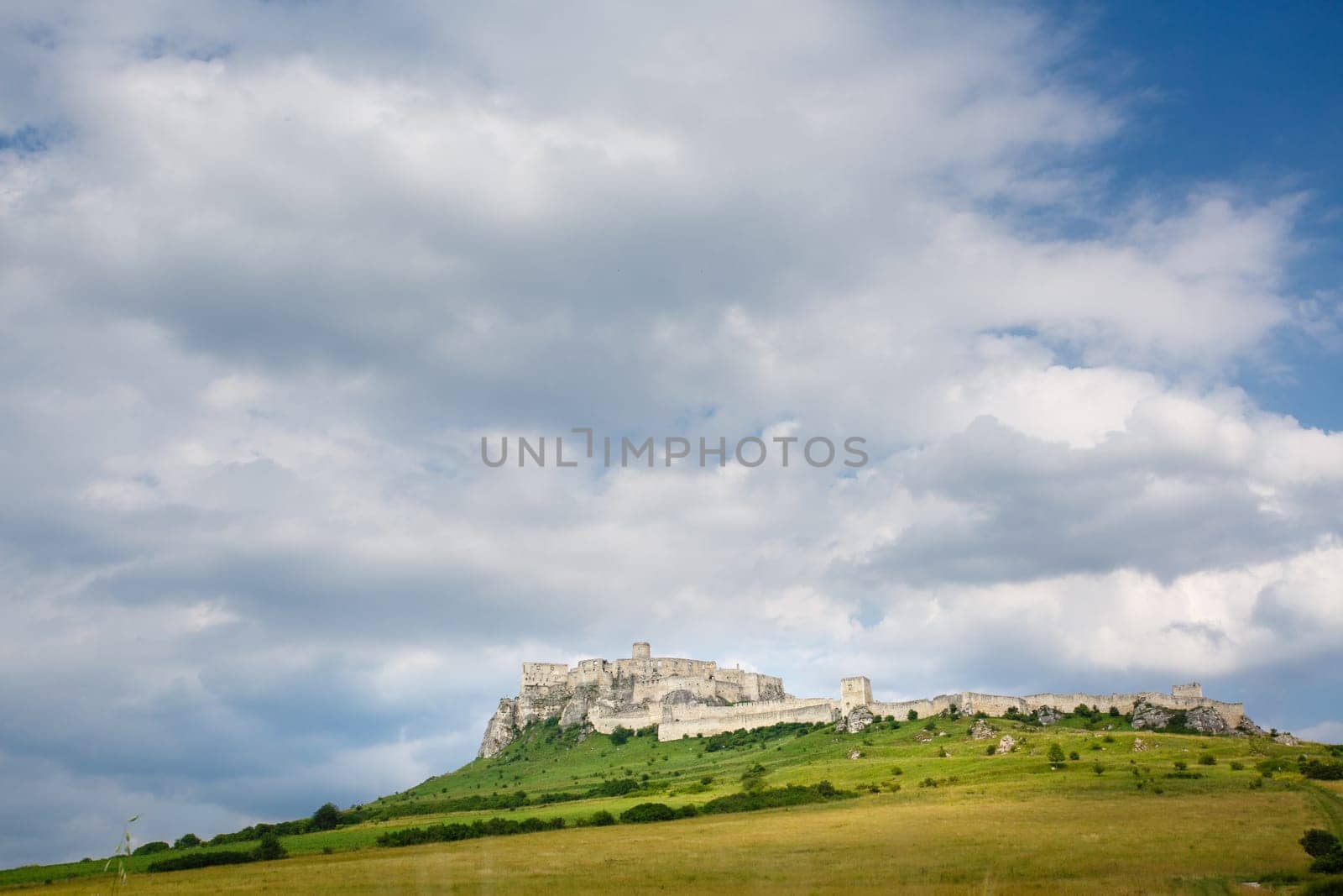 Spis Castle at sunny day with picturesque clouds, Slovakia. UNESCO World Heritage site.