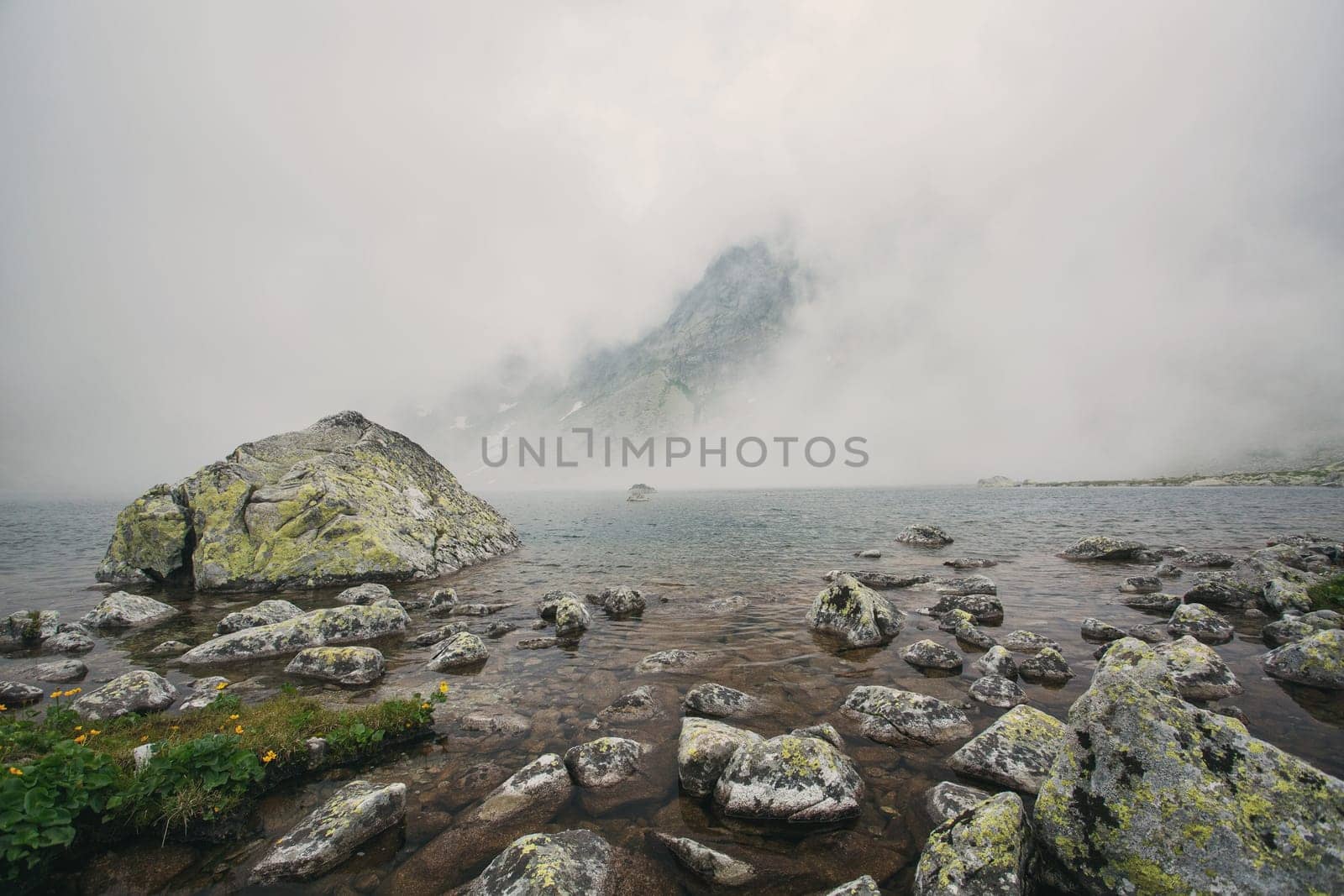 Mountain lake Hincovo pleso in High Tatras. Mountain lake Hincovo pleso in High Tatras. Slovakia. Natural misty landscape.