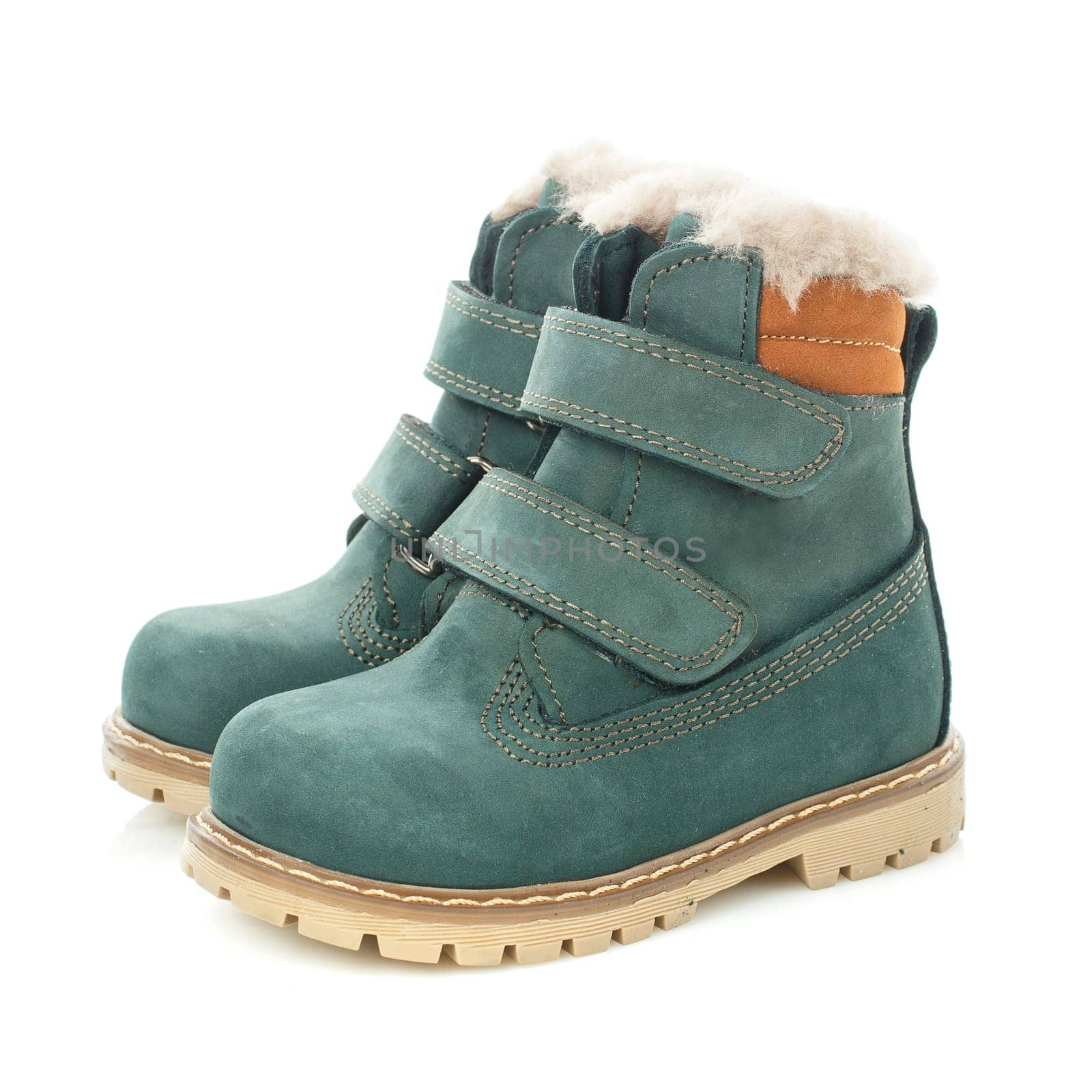 Side view of warm fur waterproof green boots with velcro and orange inserts isolated on a white background. Children's season collection.