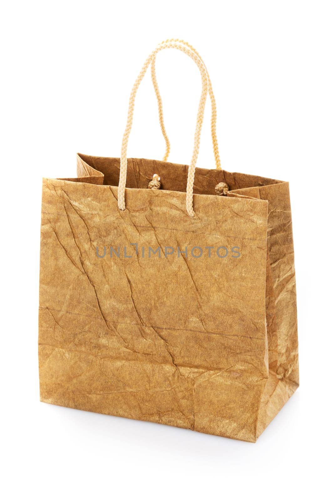 Blank brown nacre gift bag with raised handles. Package is made of crepe paper. Consumer pack ready for logo design. Advertising and branding. Isolated on a white background.