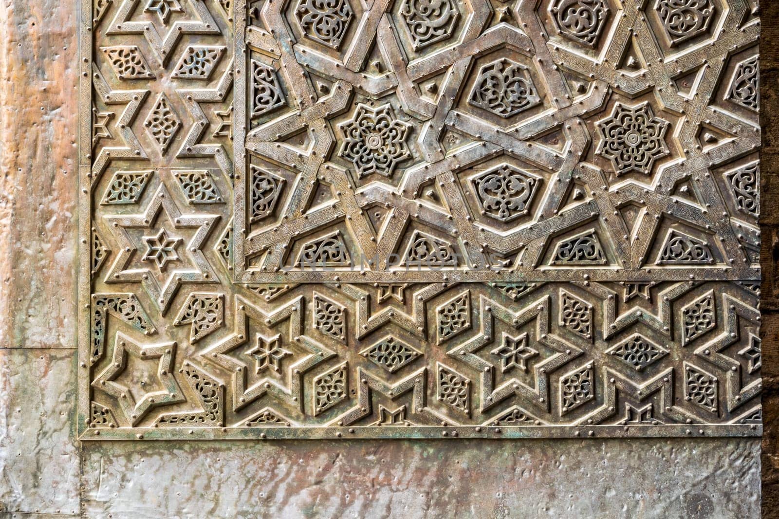 Ornaments of the bronze-plate ornate door of Sultan Qalawun mosque, an ancient historic mosque in Old Cairo, Egypt