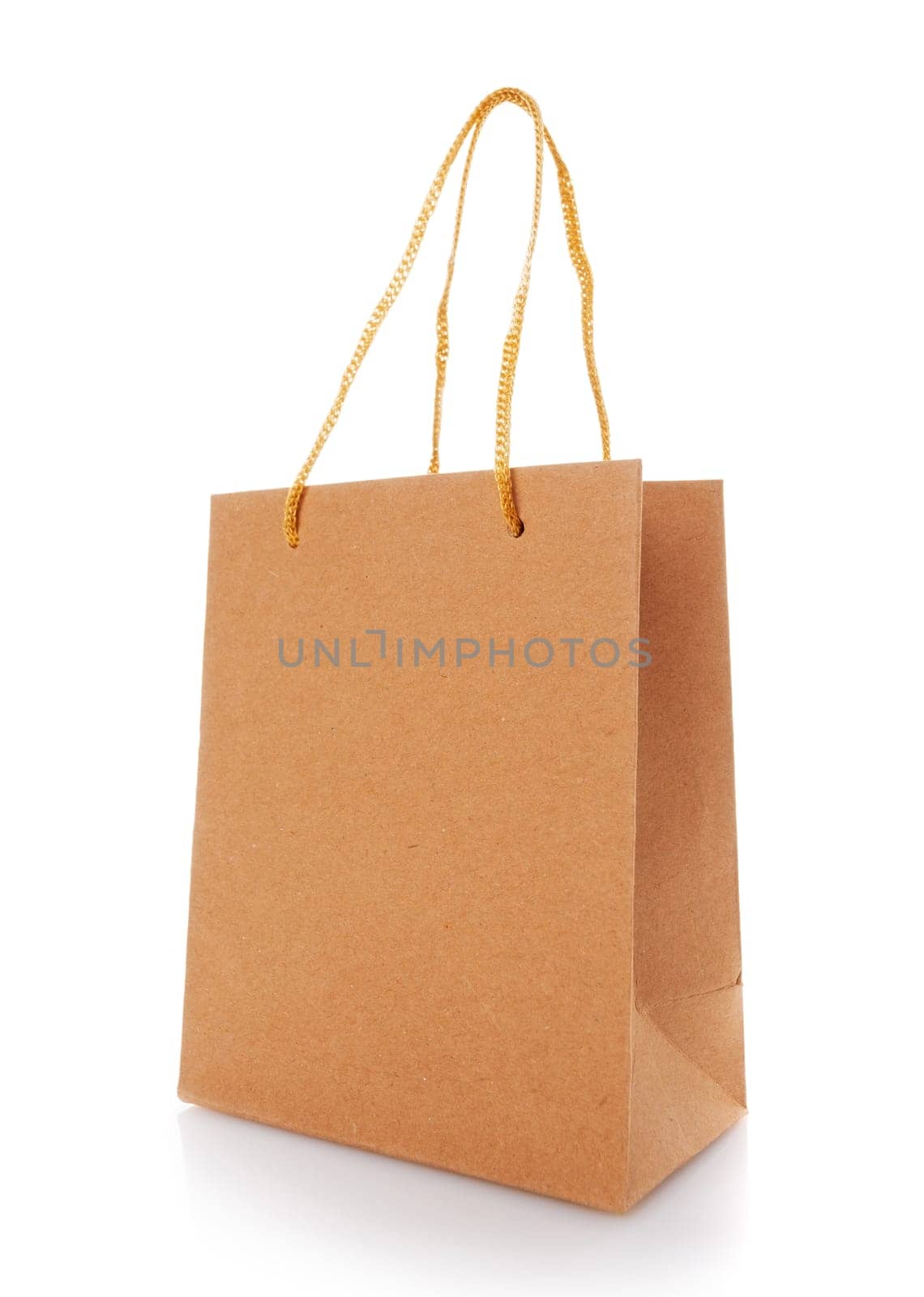 Blank shopping paper bags mockup. Empty cardboard craft bag on a white background. Consumer pack ready for logo design. Shopping and gifts concept. Side view.