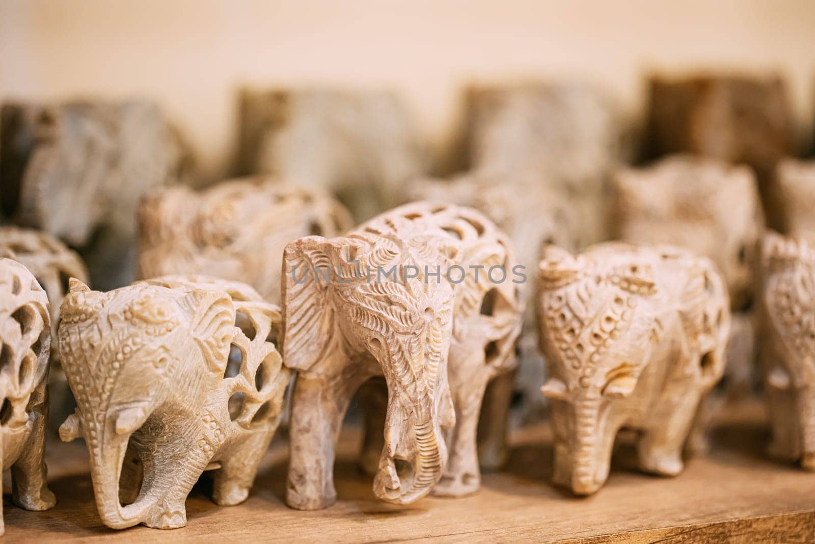 Goa, India. Elephants Souvenirs Of Stone On Shelf In Store. Goods For Tourists.