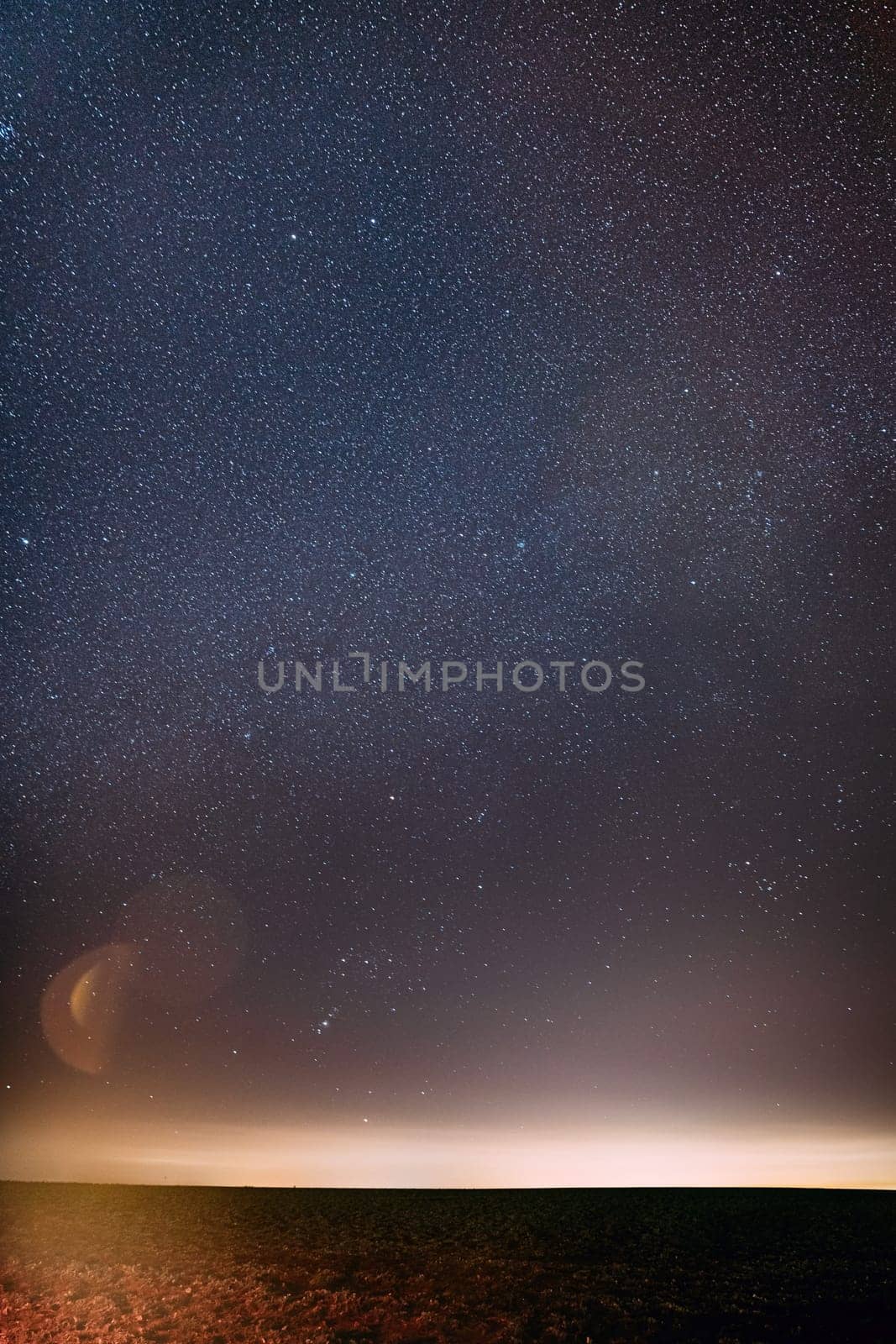 Night Starry Sky With Glowing Stars Above Countryside Landscape. Milky Way Galaxy Sky.
