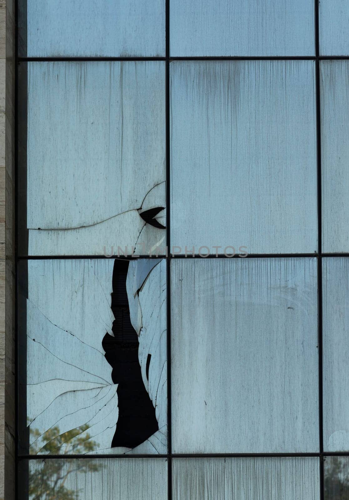 Broken windows in a modern building on the urban area