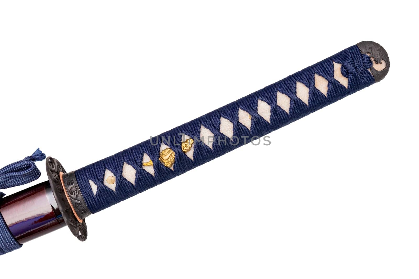 Tsuka : handle of Japanese sword wrapped by navy silk cord on white ray skin isolated in white background. Selective focus.