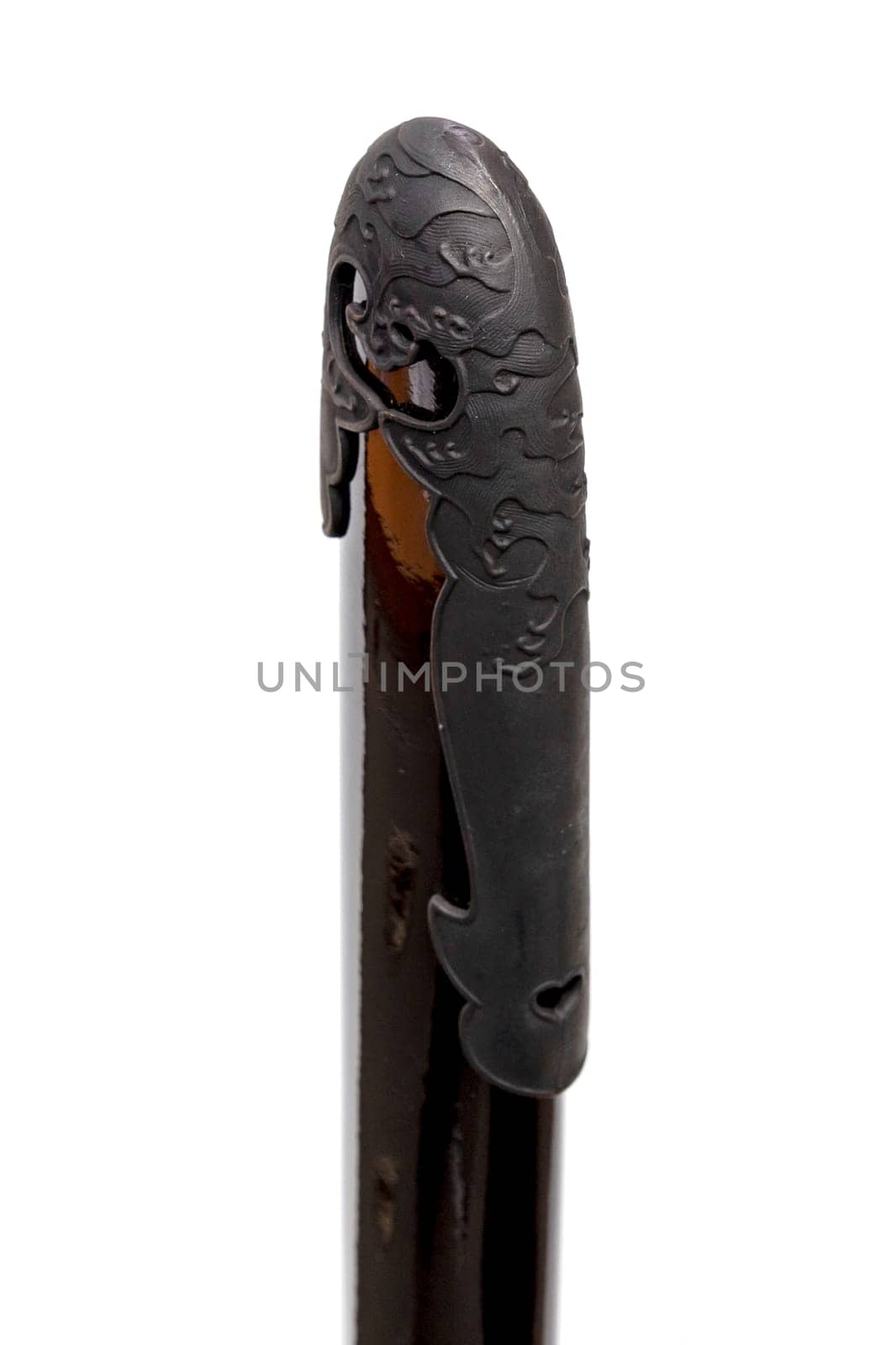 'Kojiri' is the end of the Japanese sword's scabbard or the protective fitting at the end of the scabbard. Normally made by horn but in this picture is metal. Isolated in white Background.
