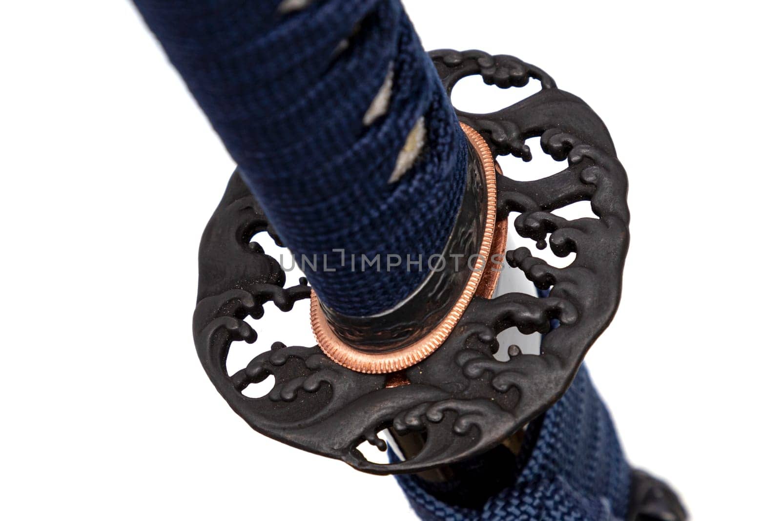 Wave Design Tsuba: Japanese sword hand guard made of steel. Sword hilt and sheath wrapped with navy cord, black scabbard, isolated on white background.
