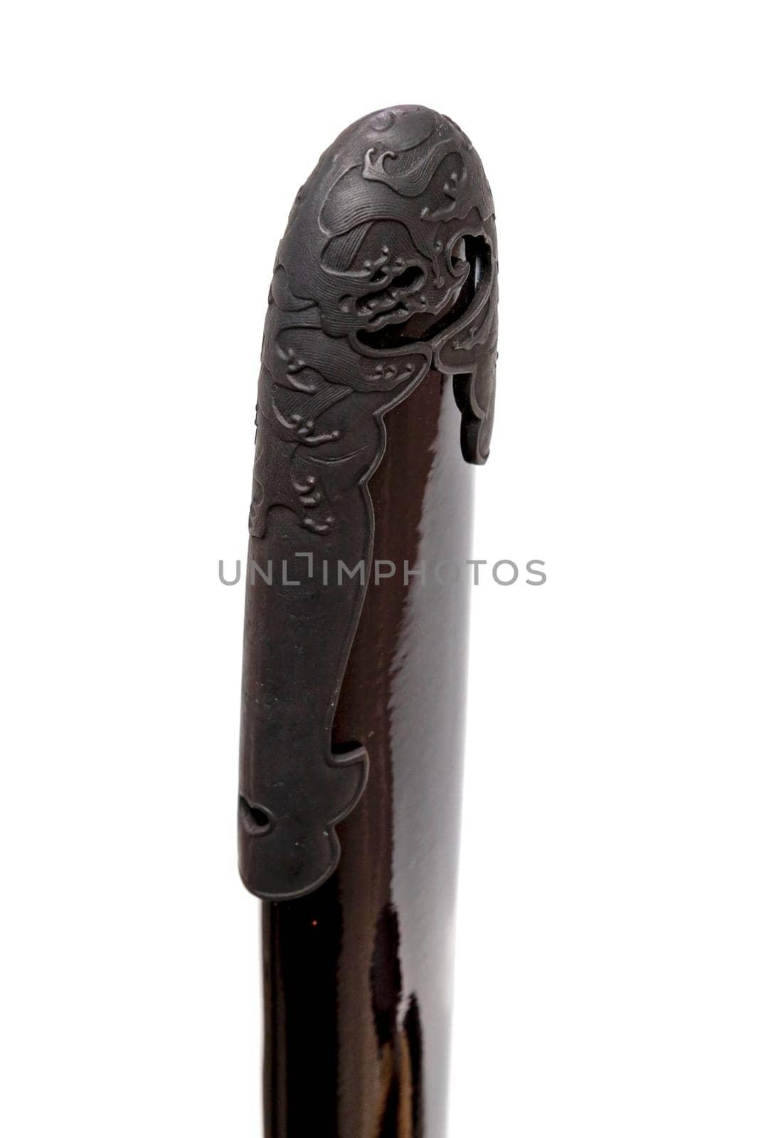 'Kojiri' is the end of the Japanese sword's scabbard or the protective fitting at the end of the scabbard. Normally made by horn but in this picture is metal. Isolated in white Background.
