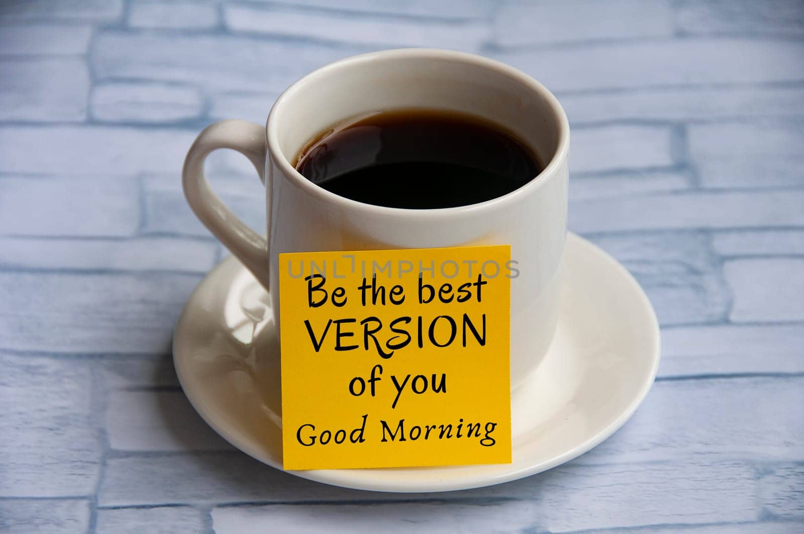 Inspirational quote text on yellow notepad on coffee cup - Be the best version of you. Greetings concept.
