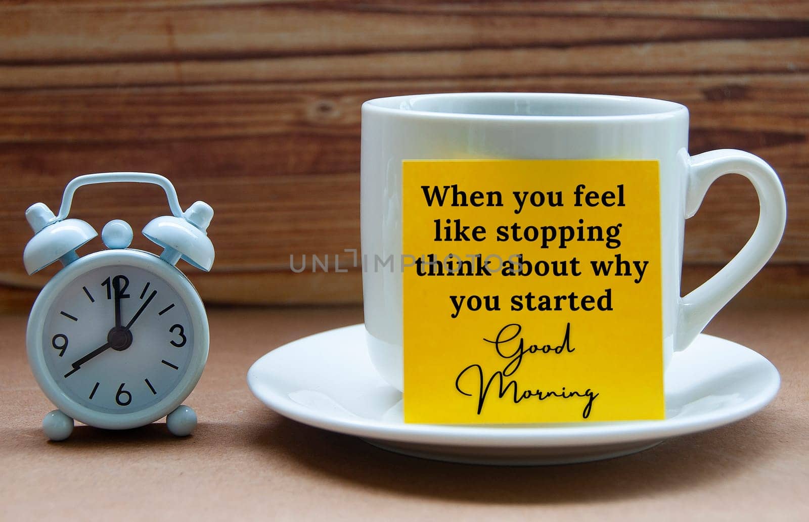 Motivational quote text on yellow notepad on coffee cup - When you feel like stopping think about why you started. Motivational and inspirational concept.