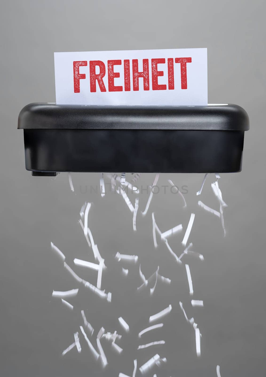 A shredder destroying a document - Liberty in german - Freiheit
